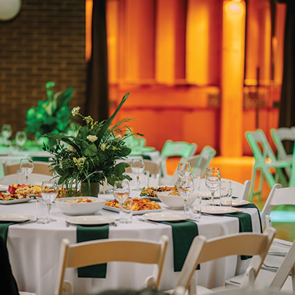 Vibrant banquet setting with orange accents