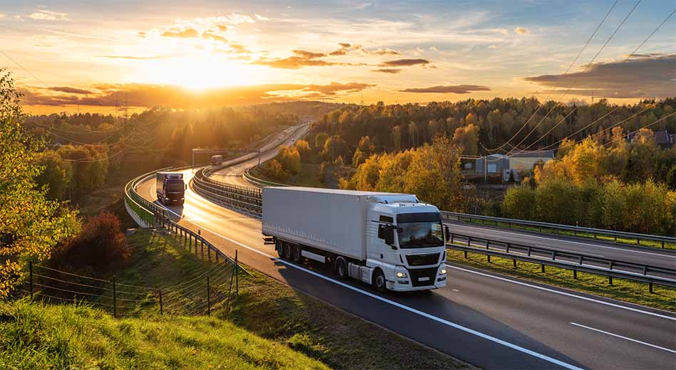 a semi-truck driving along the highway