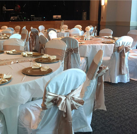 Chairs and Tables in Fancy Setup in Large Room