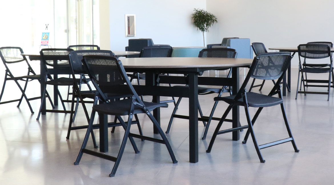 Folding Chairs Arranged Around Tables
