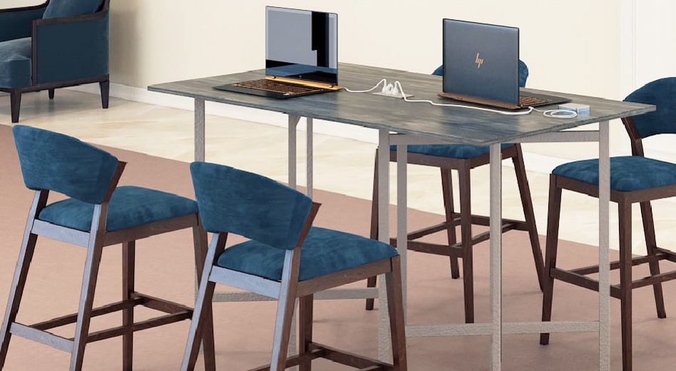 Laptop computers sitting atop a MityLite Elevare table