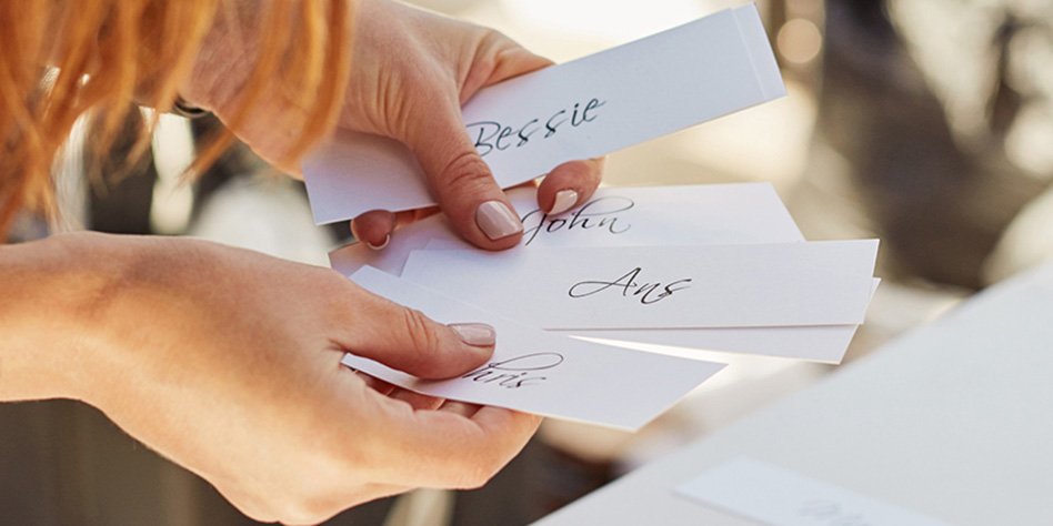 Event planner sifting through name cards