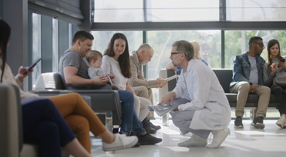 A family with small children in a hospital waiting room.