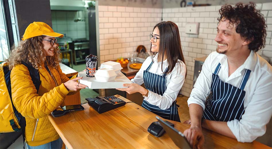 Delivery driver picking up food from a local eatery