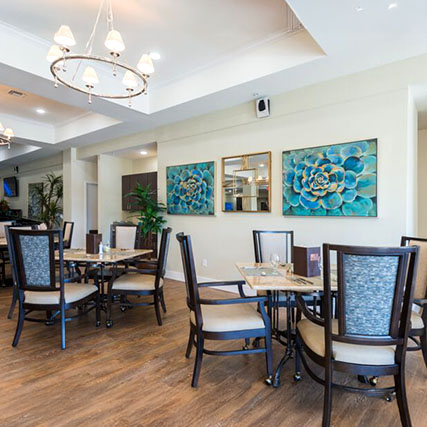 The Sutton Armchair in a tasteful Senior Living dining space.