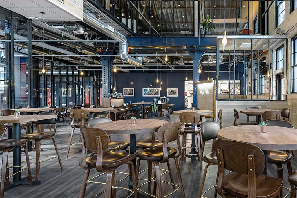 Holsag barstools in an elevated, industrial style restaurant