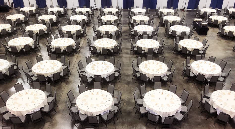 Overhead view of a large banquet setup in an expansive expo center-type space 