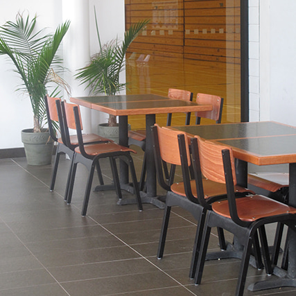 wooden chairs in a recreational facility lobby