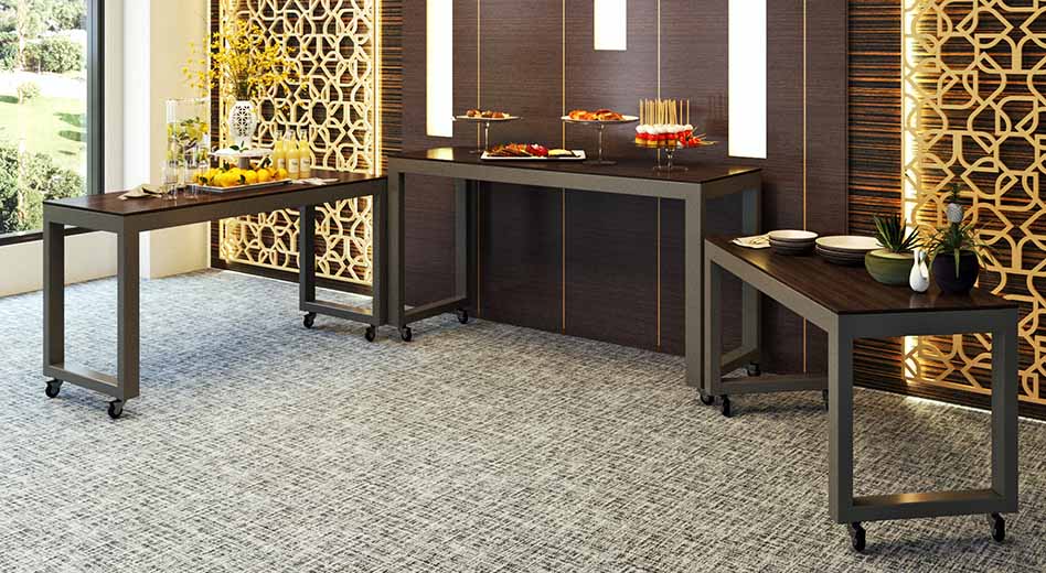 Nesting tables arranged as a snacks and refreshments stations in a modern, elegant meeting space.
