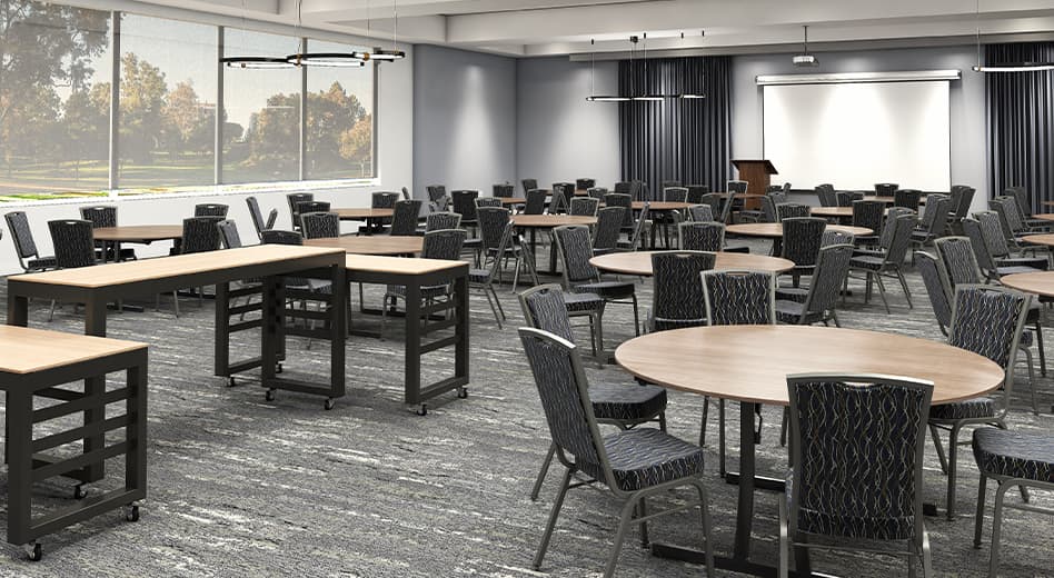 Tables and chairs arranged neatly in a banquet/conference-style space